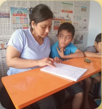 Teacher helping students